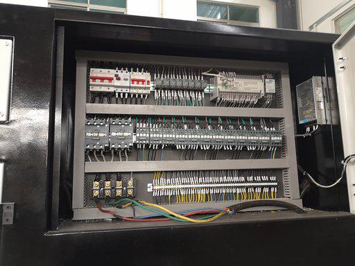  Electrical cabinet showing power supply cable, contactor et