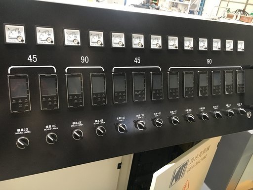 Extruder control panel showing Omron temperature controller panels