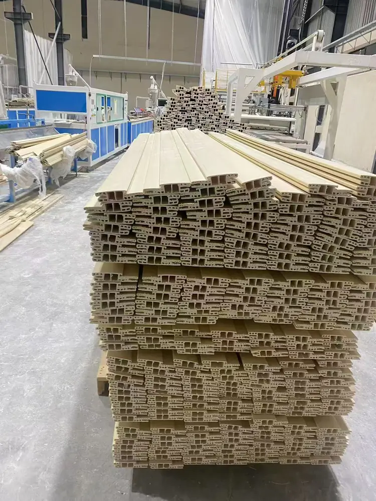 WPC door frame and decorative profiles stacked after extrusion